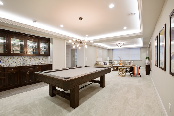 basement entertaining room with LED lighting in tray ceiling
