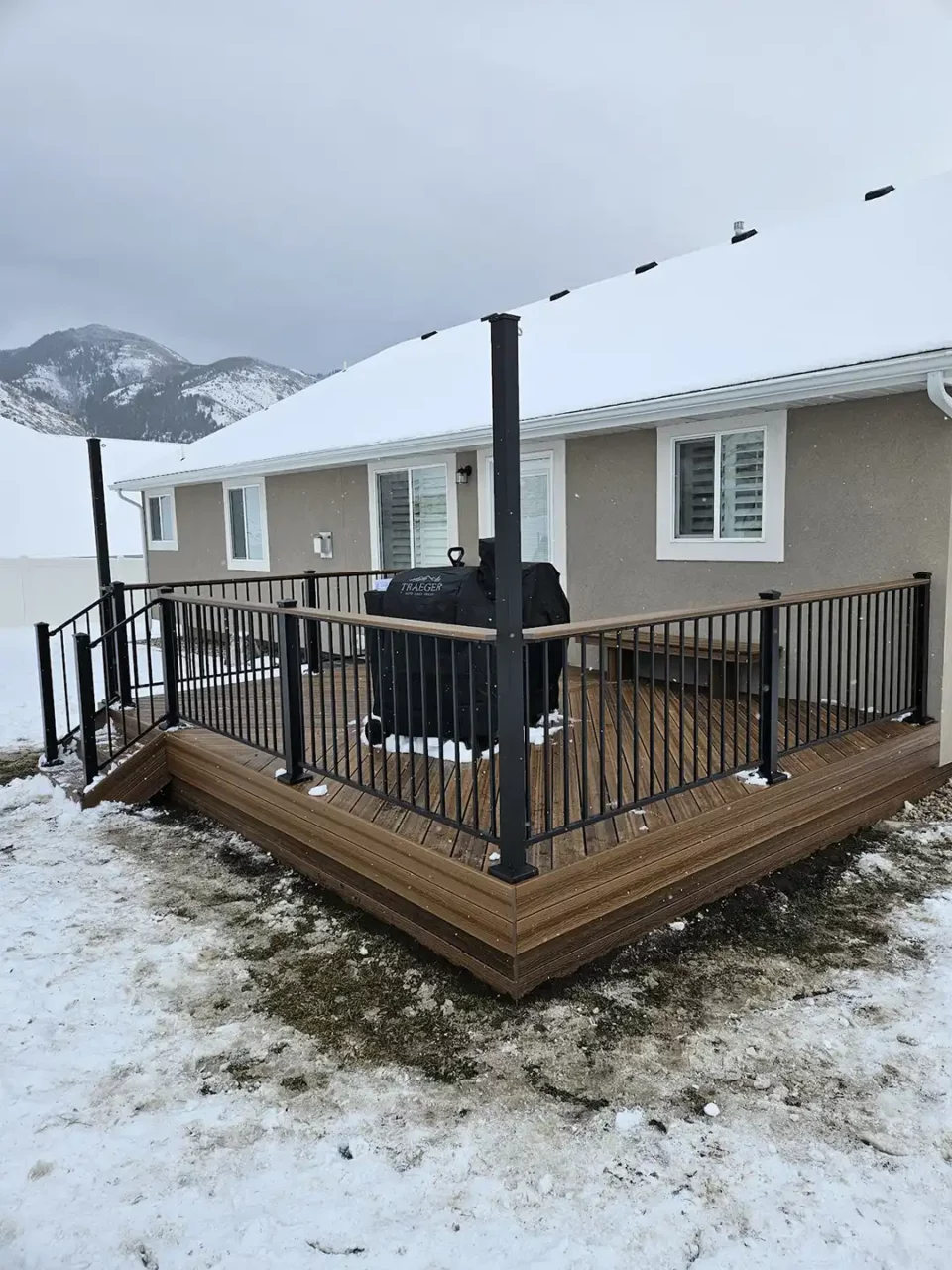 Photo of a single-level deck built in winter.