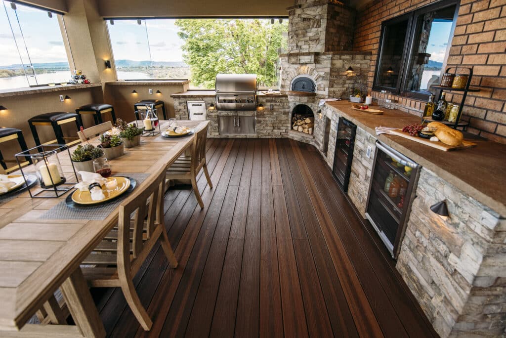Photo of Envision Decking Products used for an outdoor kitchen with wood-fire oven.