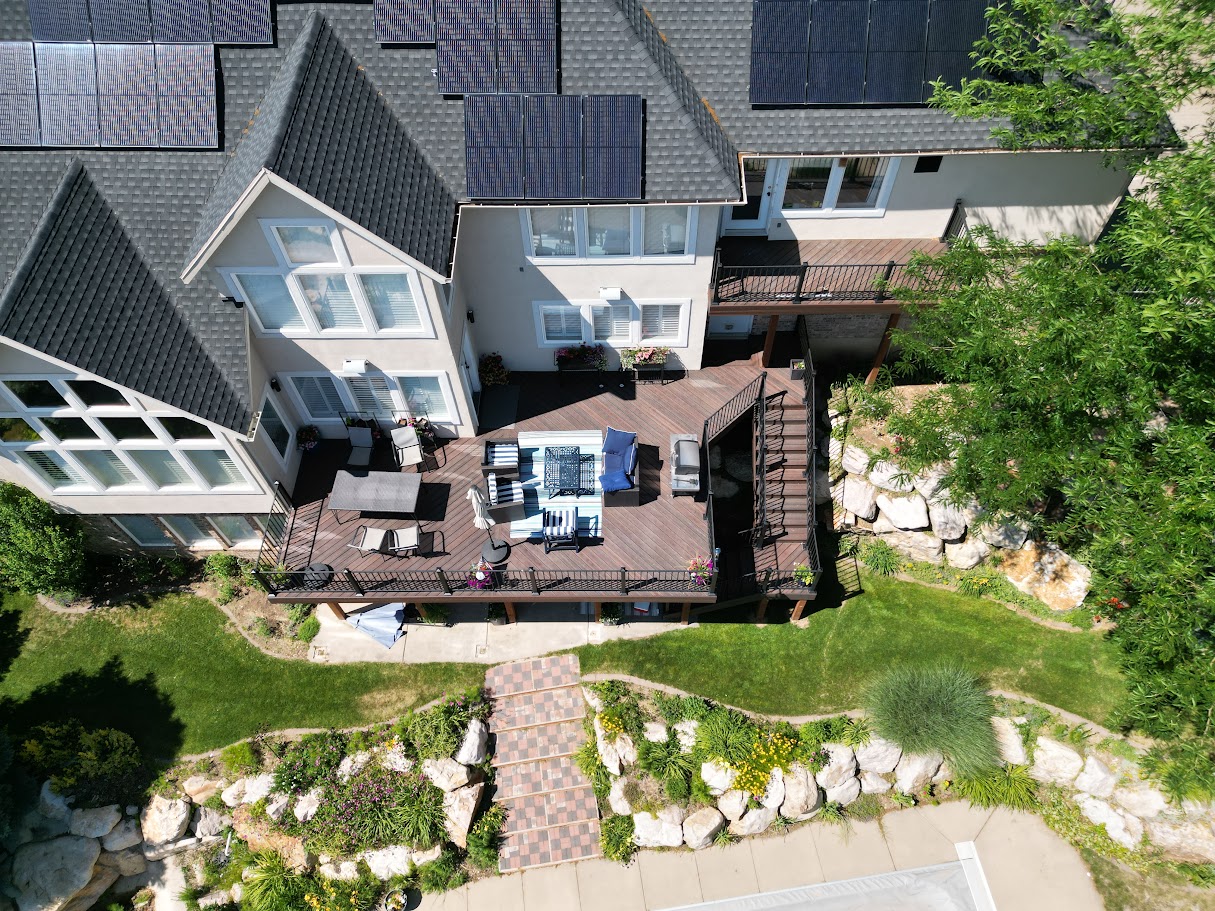 raised deck with a side balcony deck as part of a multi-level deck structure. Custom deck builders utah