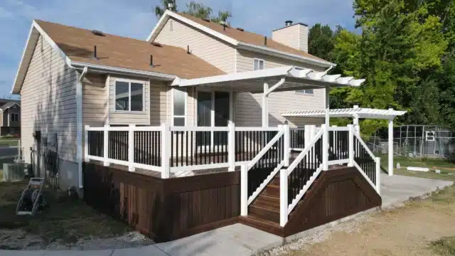 custom deck with a multi-level pergola design