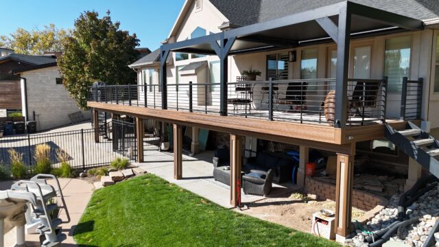 photo of elevated deck with Envision Deck Railing made of aluminum with pergola